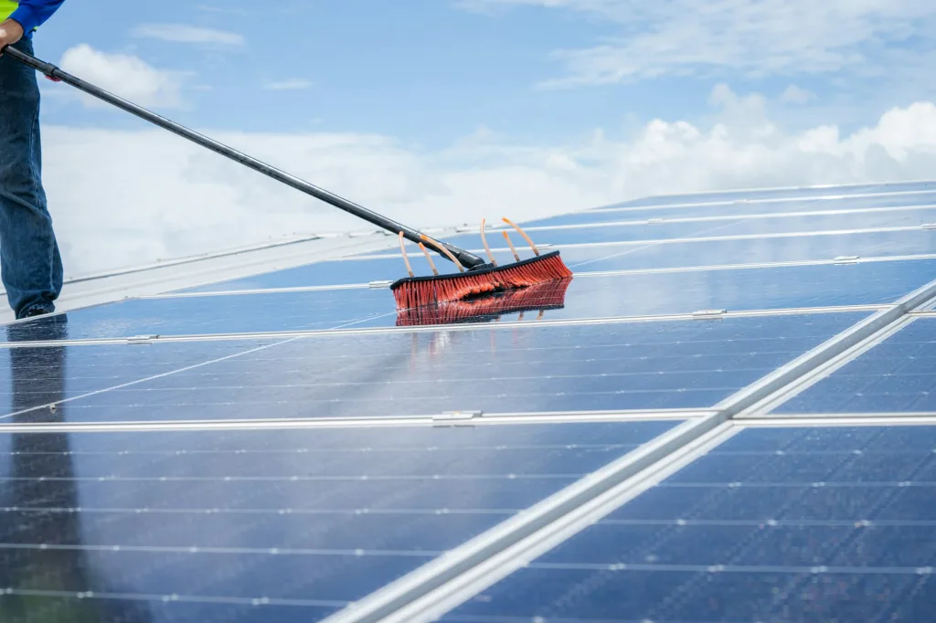 technicians are cleaning solar panel clean solar panel in solar power plant  jpg